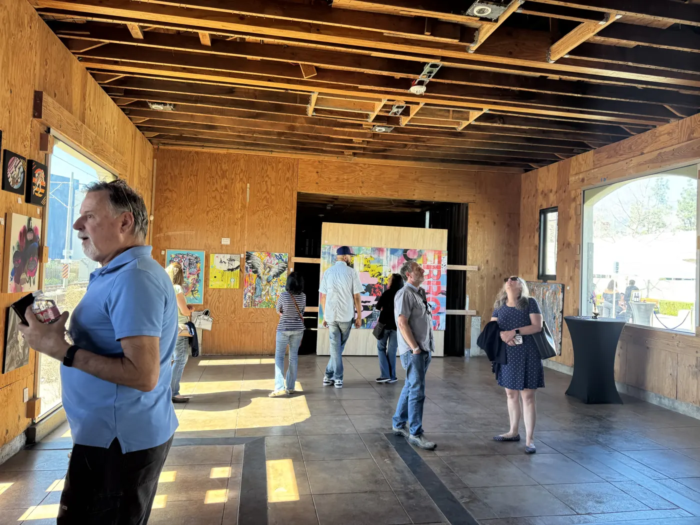 Guests walking the exhibition and looking at work
